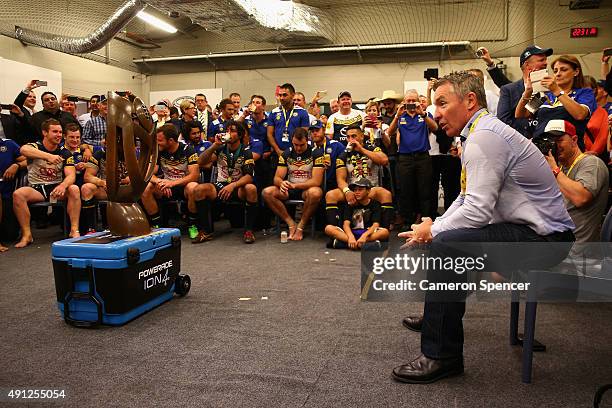 Cowboys coach Paul Green talks to his players in the Cowboys changeroom after winning the 2015 NRL Grand Final match between the Brisbane Broncos and...
