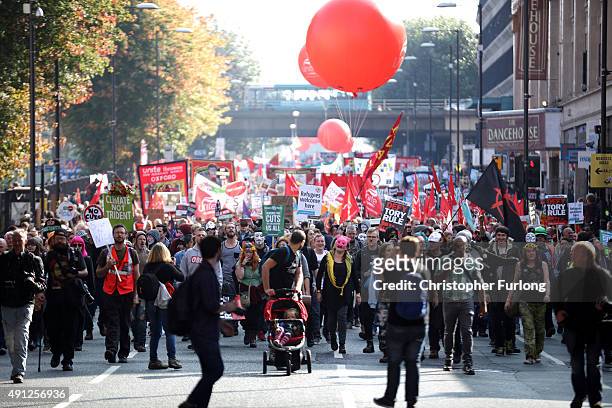 People take part in an anti-austerity protest during the first day of the Conservative Party Autumn Conference 2015 on October 4, 2015 in Manchester,...