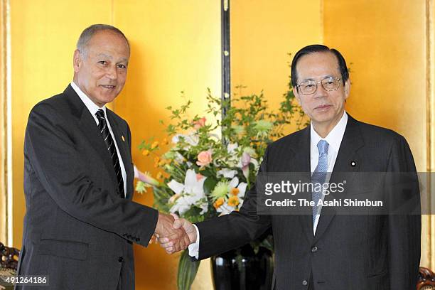 Egyptian Foreign Minister Ahmed Aboul Gheit and Japanese Prime Minister Yasuo Fukuda shake hands during their meeting on the sidelines of the Tokyo...