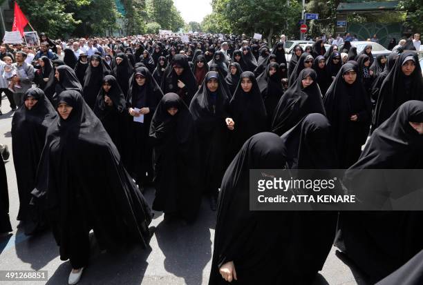 Supporters of Iranian religious hardliners take part in a demonstration after the weekly Friday prayer in Tehran on May 16, 2014 demanding that the...