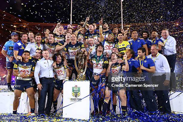 The Cowboys celebrate on the podium with the premiership trophy after winning the 2015 NRL Grand Final match between the Brisbane Broncos and the...