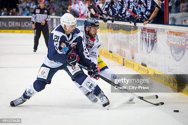 Nicolas Kraemmer of the Hamburg Freezers and Constantin Braun of the Eisbaeren Berlin during the game between Hamburg Freezers and Eisbaeren Berlin...