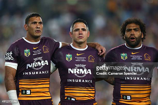 Justin Hodges of the Broncos, Corey Parker of the Broncos and Sam Thaiday of the Broncos sing the national anthem before the 2015 NRL Grand Final...