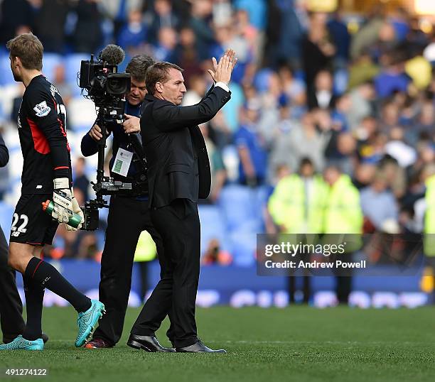 Brendan Rodgers manager of Liverpool shows his appreciation to the fans at the end of the Barclays Premier League match between Everton and Liverpool...