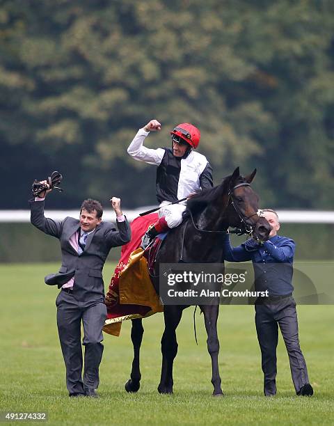 Frankie Dettori riding Golden Horn celebrate winning The Qatar Prix De L'Arc De Triomphe at Longchamp racecourse on October 04, 2015 in Paris, France.