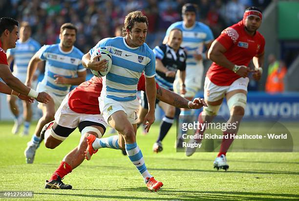 Nicolas Sanchez of Argentina makes a break to score their third try during the 2015 Rugby World Cup Pool C match between Argentina and Tonga at...