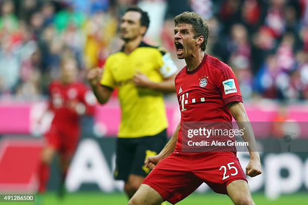 Thomas Mueller of Muenchen celebrates his team's first goal during the Bundesliga match between FC Bayern Muenchen and Borussia Dortmund at Allianz...