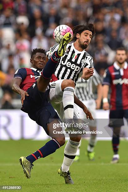 Sami Khedira of Juventus FC is challenged by Amadou Diawara of Bologna FC during the Serie A match between Juventus FC and Bologna FC at Juventus...