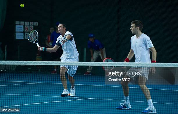 Colin Fleming of Britain and Jonathan Erlich of Israel return a shot against Chris Guccione of Australia and Andre Sa of Brazil during the men's...