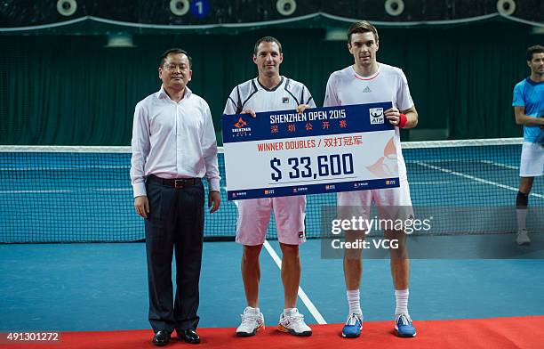 Colin Fleming of Britain and Jonathan Erlich of Israel pose with their award after beating Chris Guccione of Australia and Andre Sa of Brazil during...