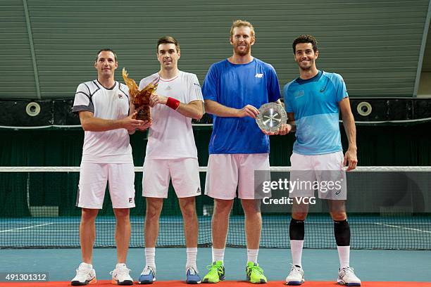 Colin Fleming of Britain and Jonathan Erlich of Israel pose with their trophy after beating Chris Guccione of Australia and Andre Sa of Brazil during...