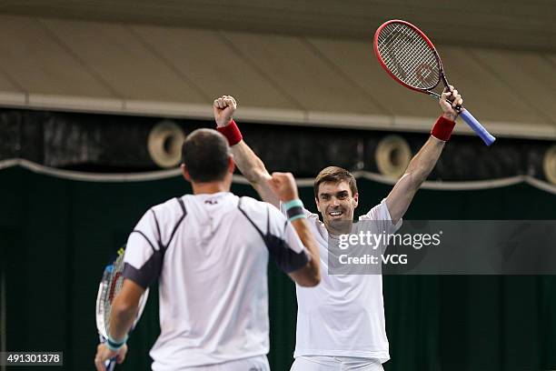 Colin Fleming of Britain and Jonathan Erlich of Israel celebrate after beating Chris Guccione of Australia and Andre Sa of Brazil during the men's...
