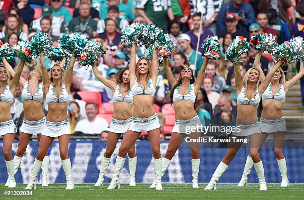 The Miami Dolphin Cheerleaders dance at the NFL International fixture as the New York Jets compete against the Miami Dolphins at Wembley Stadium on...