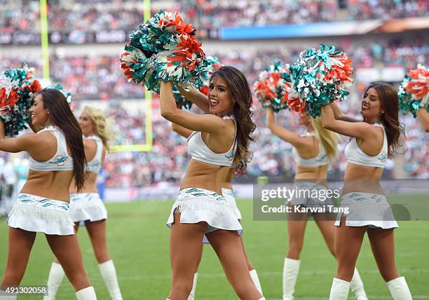 The Miami Dolphin Cheerleaders dance at the NFL International fixture as the New York Jets compete against the Miami Dolphins at Wembley Stadium on...