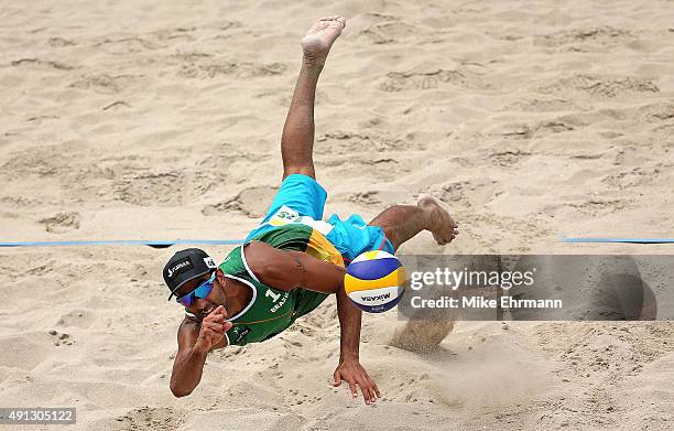 Pedro Solberg of Brazil plays a shot during the bronze medal match against Alexander Brouwer and Robert Meeuwsen of the Netherlands at the FIVB Fort...