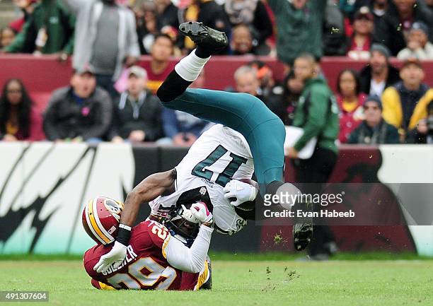 Nelson Agholor of the Philadelphia Eagles is tackled by Chris Culliver of the Washington Redskins at FedExField on October 4, 2015 in Landover,...