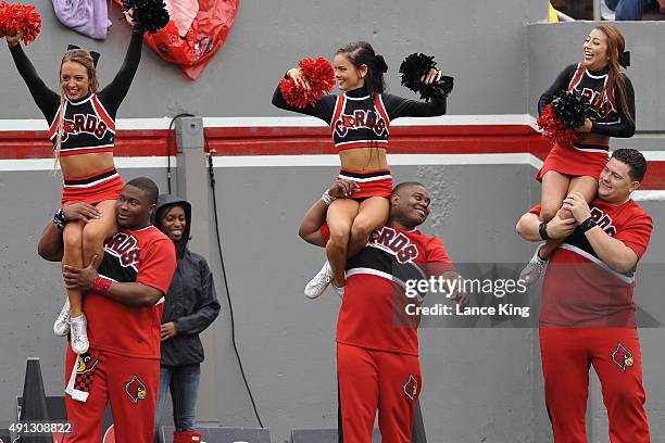 Cheerleaders of the Louisville Cardinals perform during their game against the North Carolina State Wolfpack at Carter-Finley Stadium on October 3,...