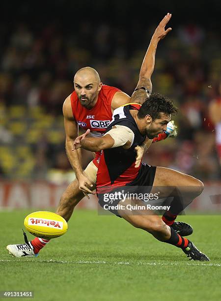 Rhyce Shaw of the Swans and Courtenay Dempsey of the Bombers contest for the ball during the round nine AFL match between the Essendon Bombers and...