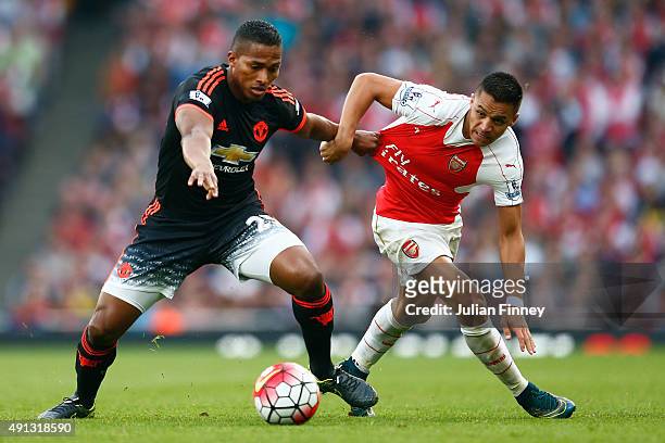 Antonio Valencia of Manchester United battles with Alexis Sanchez of Arsenal during the Barclays Premier League match between Arsenal and Manchester...