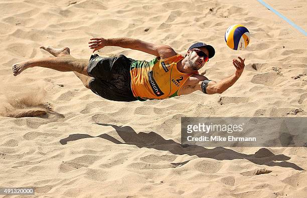 Oscar Schmidt Bruno of Brazil plays a shot during the gold medal match against Nick Lucena and Phil Dalhausser of the United States at the FIVB Fort...