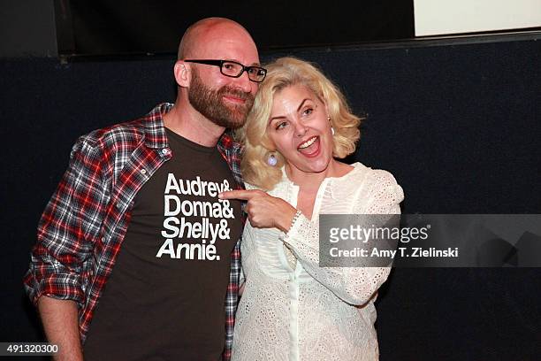 Actress Sherilyn Fenn who played on the TV series Twin Peaks the character Audrey Horne poses for pictures with a fan during the sixth annual Twin...