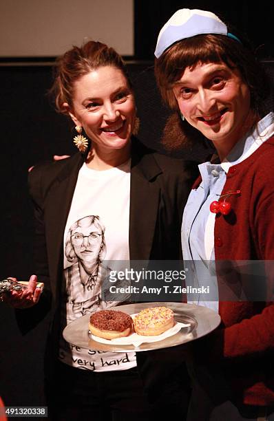 Actress Madchen Amick who played Shelly Johnson on the TV series Twin Peaks poses for pictures with a fan named Holly Mackerel dressed as David...