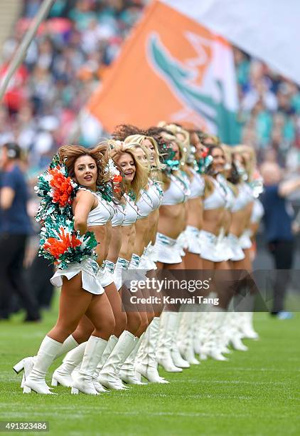 The Miami Dolphin Cheerleaders dance at the NFL International fixture as the New York Jets compete against the Miami Dolphins at Wembley Stadium on...