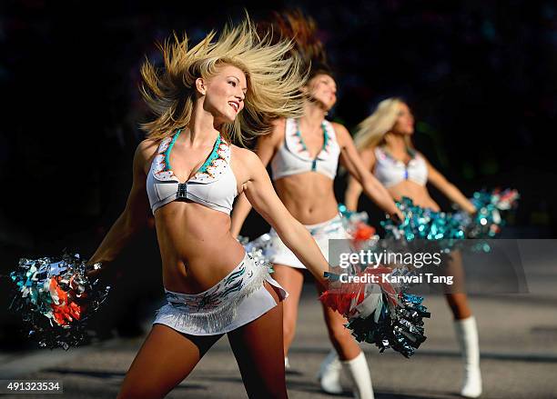 The Miami Dolphin Cheerleaders dance at the NFL International fixture as the New York Jets compete against the Miami Dolphins at Wembley Stadium on...