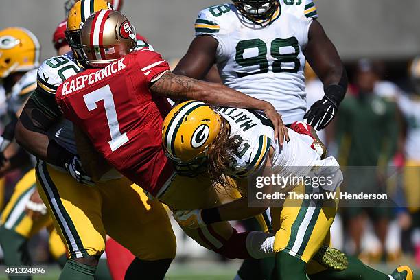 Inside linebacker Clay Matthews of the Green Bay Packers hits quarterback Colin Kaepernick of the San Francisco 49ers during their NFL game at Levi's...