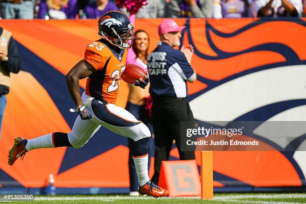 Running back Ronnie Hillman of the Denver Broncos scores a touchdown on an 72 yard rush in the second quarter of a game against the Minnesota Vikings...