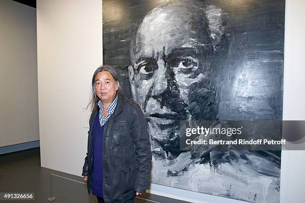 Artist Yan Pei Ming poses in front of his work during the 'Picasso Mania' : Press Preview. Held at Grand Palais on October 4, 2015 in Paris, France.