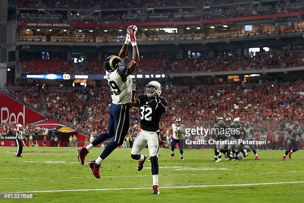 Tight end Jared Cook of the St. Louis Rams can't haul in a pass while being defended by free safety Tyrann Mathieu of the Arizona Cardinals during...
