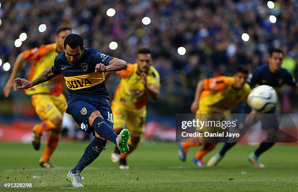 Carlos Tevez of Boca Juniors takes a penalty kick during a match between Boca Juniors and Crucero del Norte as part of 27th round of Torneo Primera...