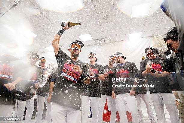 The Texas Rangers celebrate winning their sixth AL West Title after a baseball game against the Los Angeles Angels at Globe Life Park on October 4,...
