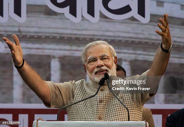 Leader Narendra Modi gestures while speaking to supporters after his landslide victory in elections on May 16, 2014 in Vadodara, India. Early...