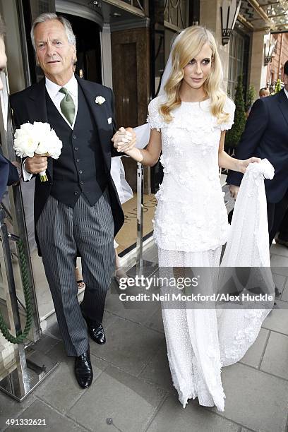 Charles Delevingne and Poppy Delevingne sighted leaving Claridges Hotel prior to Poppy's wedding on May 16, 2014 in London, England.