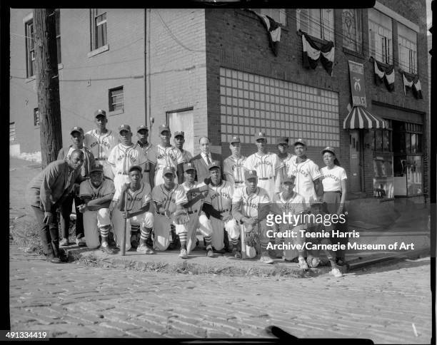 Monarchs baseball team posed on street corner, Pittsburgh, Pennsylvania, August 1963. First row from left: unknown man, Alvin Muldrow, Larry Bryant,...