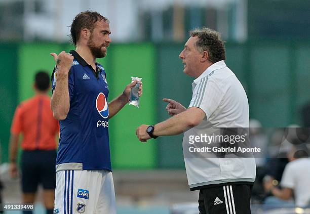 Ruben Israel coach of Millonarios gives directions to his player Federico Insua during a match between Alianza Petrolera and Millonarios as part of...