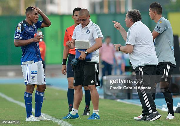 Ruben Israel coach of Millonarios gives directions to his player Elkin Blanco during a match between Alianza Petrolera and Millonarios as part of...