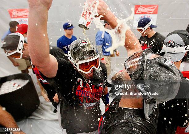 The Texas Rangers celebrate winning their sixth AL West Title after a baseball game against the Los Angeles Angels at Globe Life Park on October 4,...