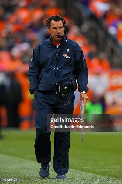 Head coach Gary Kubiak of the Denver Broncos walks the sideline during a game against the Minnesota Vikings at Sports Authority Field at Mile High on...