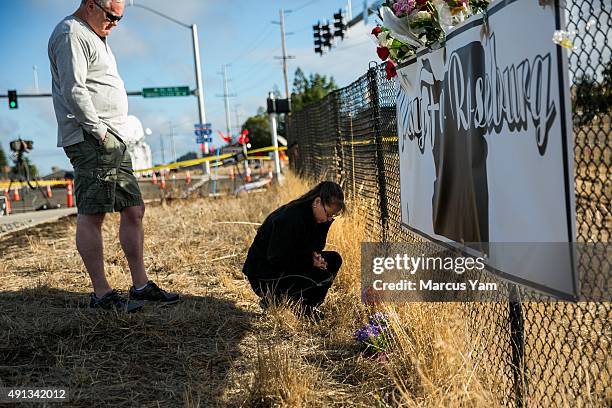 Dave and Robin Griffith, from Portland, stopped by the makeshift memorial to pay their respects after the mass shootings in Umpqua Community College,...