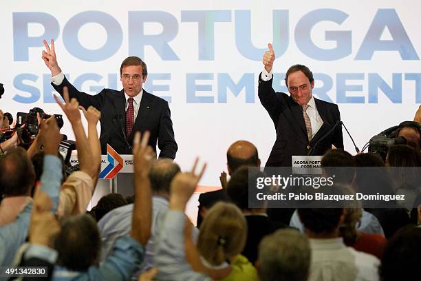 Portuguese Prime Minister and Social Democratic Party's leader Pedro Passos Coelho and Portuguese deputy prime minister Paulo Portas celebrates...