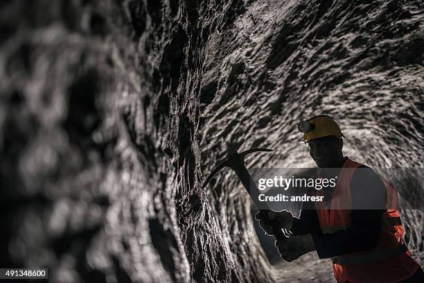 man mining underground - miner pick stock pictures, royalty-free photos & images