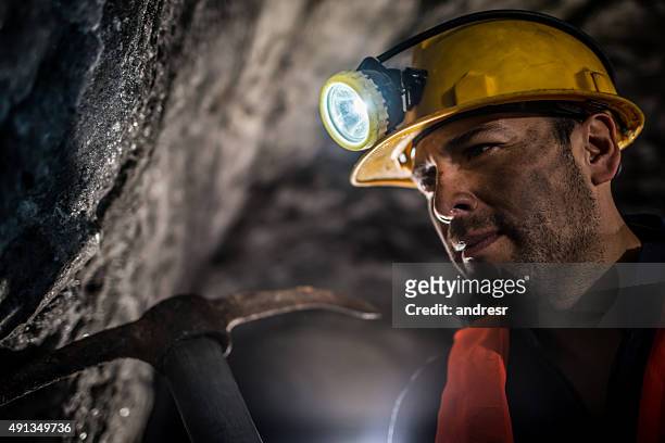miner working at a mine underground - coal miner stock pictures, royalty-free photos & images