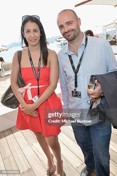 Leila Hachachnia and Pascal Tessaud attend Deadline's Cocktails on the Croisette in partnership with AmericanExpress and Film Fraternity at La Gold...