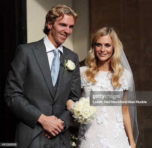 James Cook and Poppy Delevingne at their wedding at St Pauls Church, Knightsbridge on May 16, 2014 in London, England.