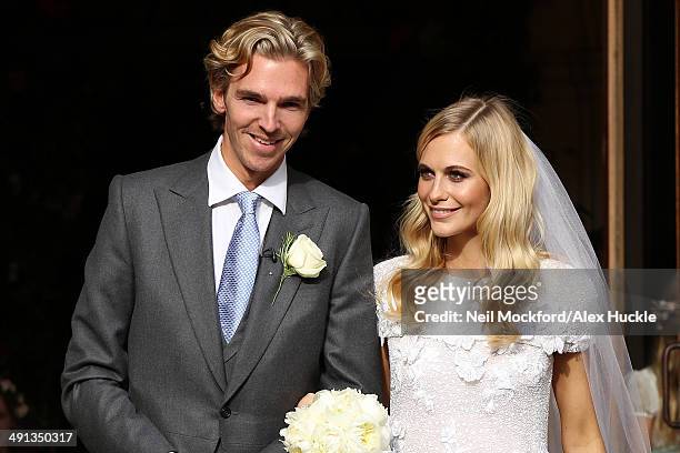 Poppy Delevingne and James Cook leaving St Paul's Church after their wedding on May 16, 2014 in London, England.