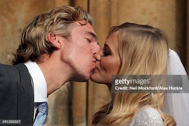 James Cook and Poppy Delevingne at their wedding at St Pauls Church, Knightsbridge on May 16, 2014 in London, England.