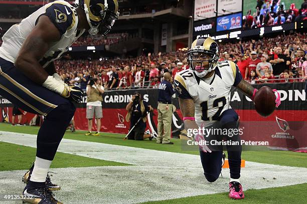 Wide receiver Stedman Bailey of the St. Louis Rams celebrates his third quarter touchdown with wide receiver Kenny Britt during the NFL game against...